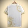 maillot-supporter-real-madrid-concept-premium-avec-motif-dragon-dore-edition-limitee supportrartröja Real Madrid koncept premium med gyllene drakmönster begränsad upplaga