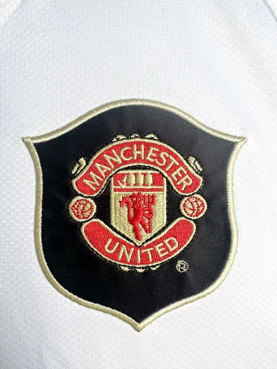 Manchester United fotbollströja röd vintage bortamodell